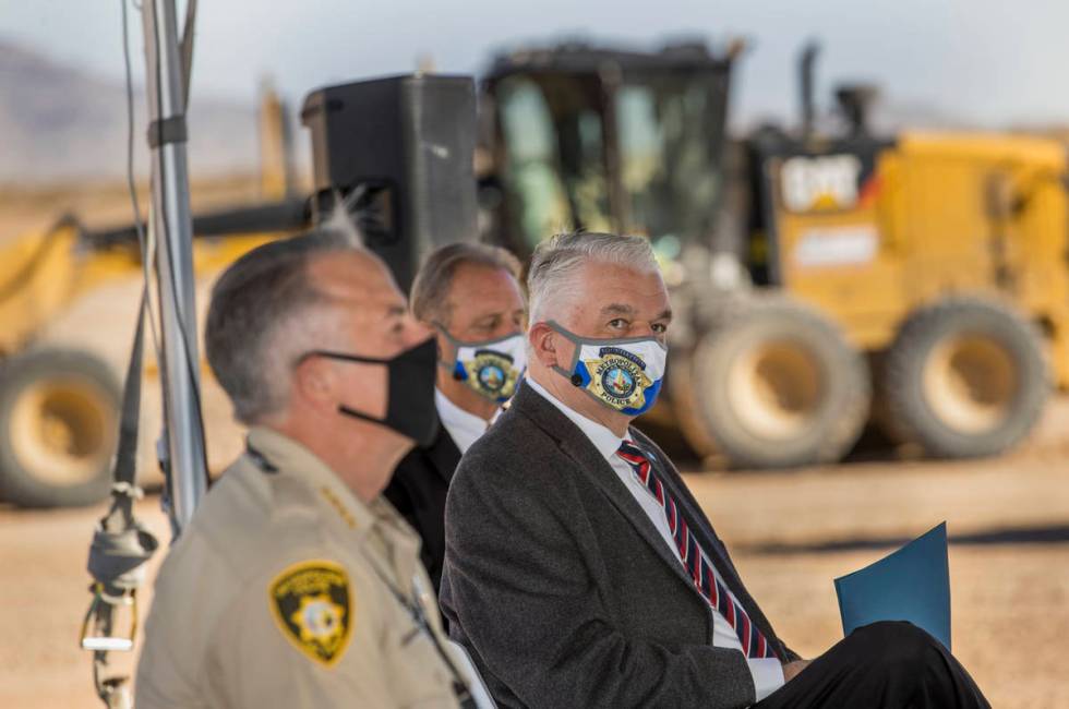 Sheriff Joseph Lombardo, left, Governor Steve Sisolak, right, and North Las Vegas Mayor John L ...