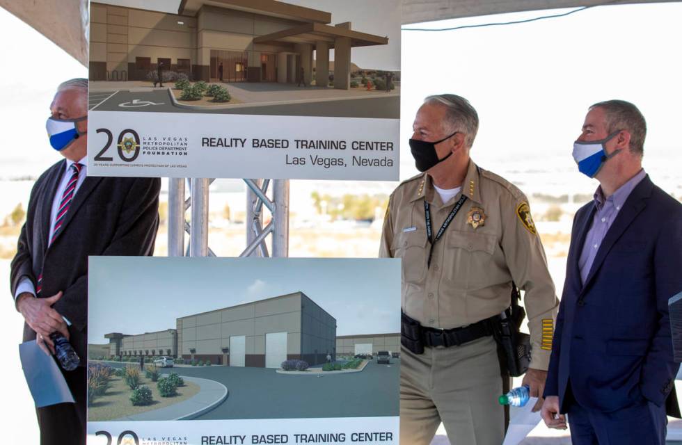 Governor Steve Sisolak, left, Sheriff Joseph Lombardo, center, Executive Director of the LVMPD ...