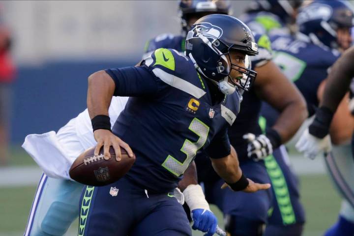 Seattle Seahawks quarterback Russell Wilson in action against the Dallas Cowboys during an NFL ...