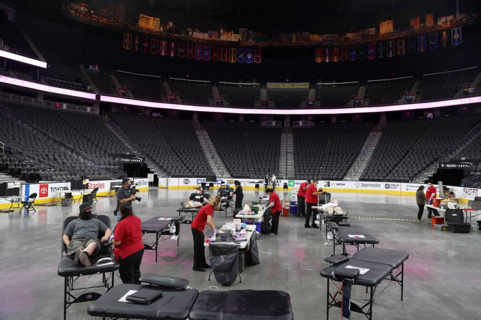 People participate during a blood donation drive hosted by the American Red Cross and the Vegas ...