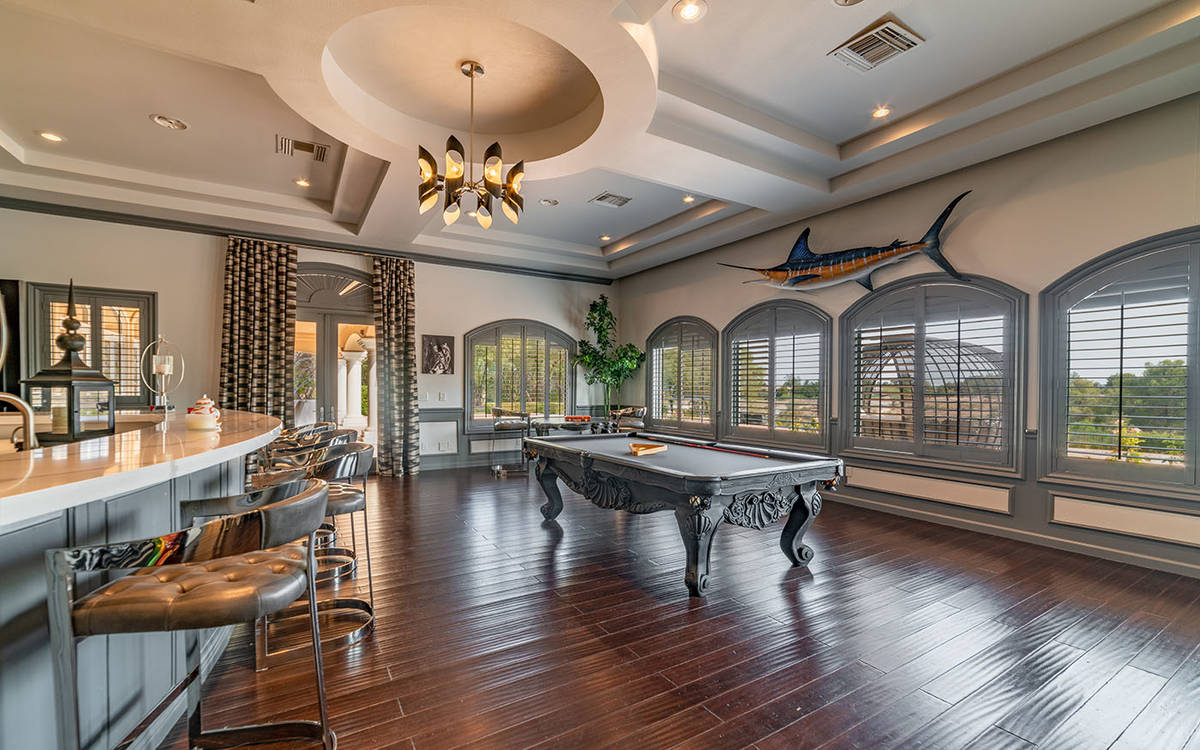 The main level of the home has a billiards room with extensive wet bar and sports media room. ( ...
