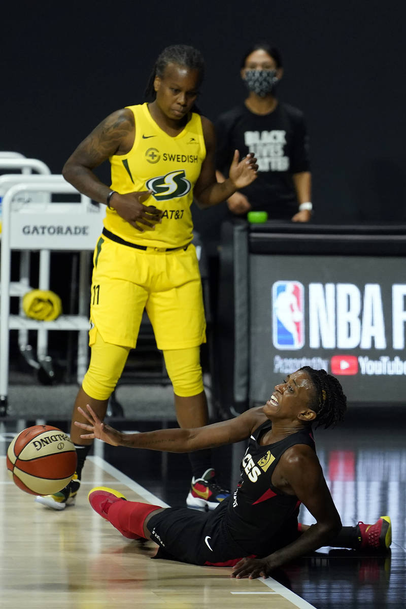Las Vegas Aces guard Danielle Robinson (3) gets fouled by Seattle Storm guard Epiphanny Prince ...