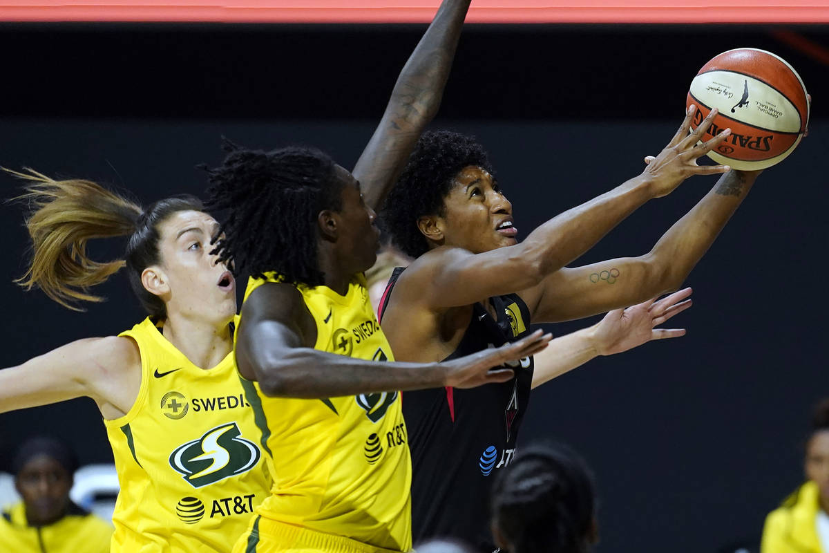 Las Vegas Aces forward Angel McCoughtry (35) drives to the basket after getting around Seattle ...
