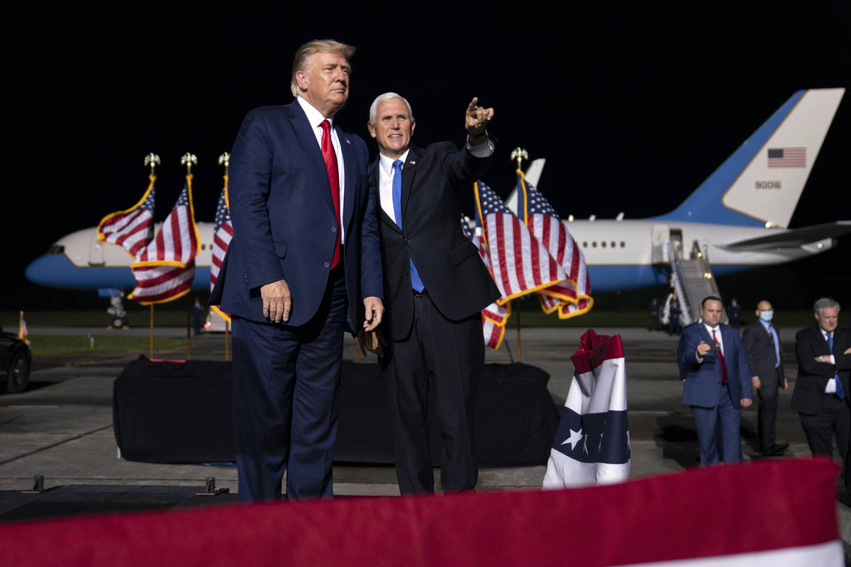 President Donald Trump and Vice President Mike Pence arrive for a campaign rally, Friday, Sept. ...