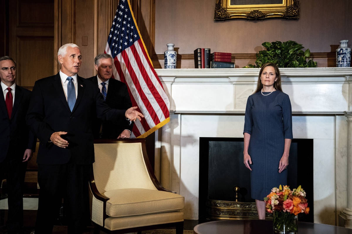 Judge Amy Coney Barrett, President Donald Trump's nominee to the Supreme Court, right, meets wi ...