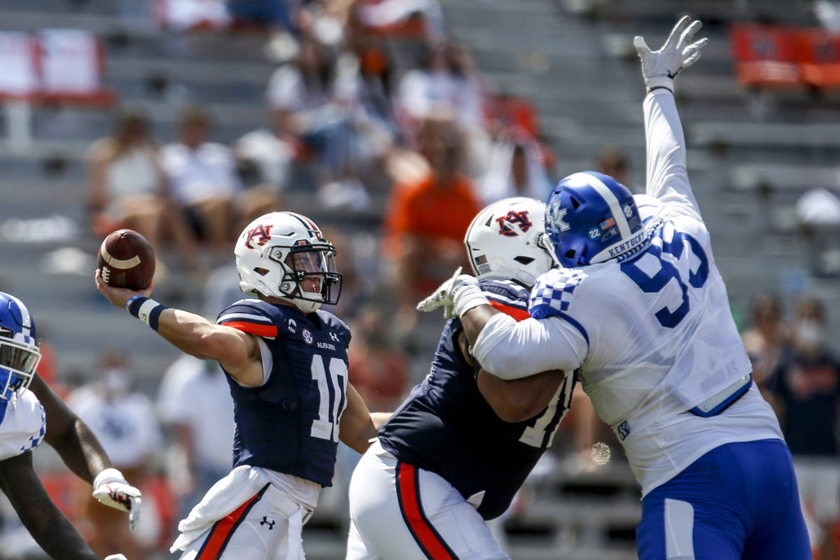 Auburn quarterback Bo Nix (10) throws a pass during the third quarter of an NCAA college footba ...