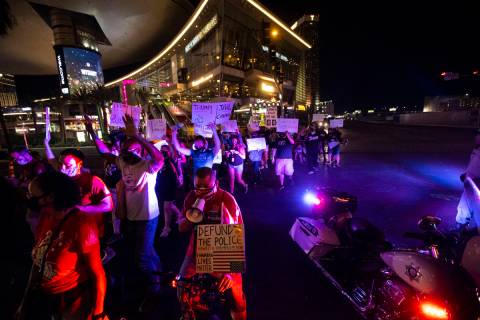 People march along Las Vegas Boulevard in memory of Jorge Gomez and other victims of police vio ...