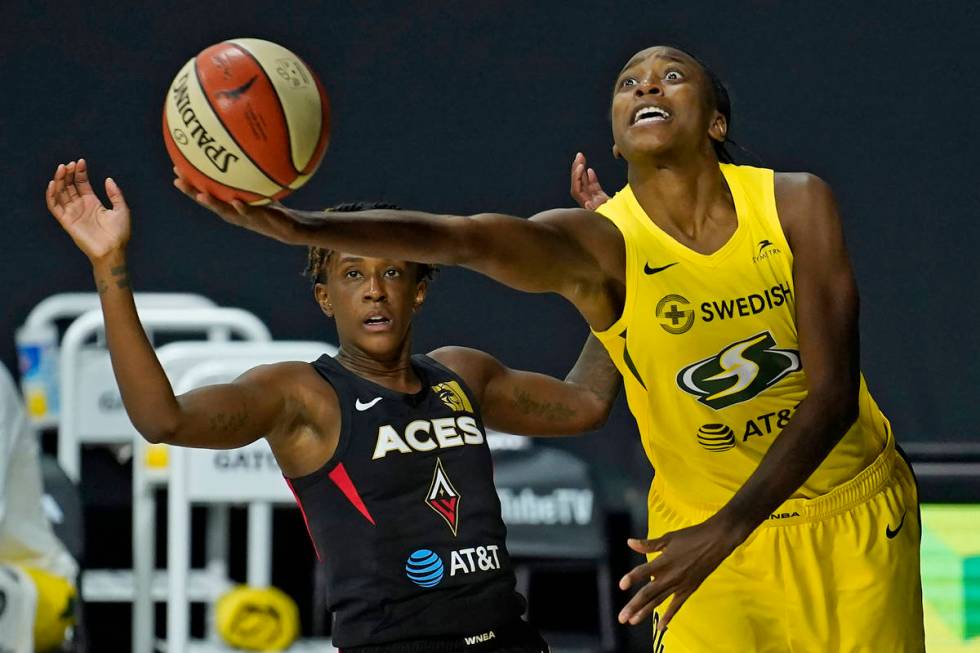 Seattle Storm guard Jewell Loyd (24) goes up for a shot after getting around Las Vegas Aces gua ...