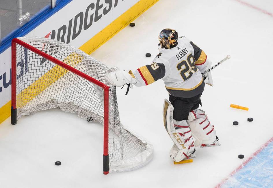 Vegas Golden Knights goalie Marc-Andre Fleury moves the net before leaving the ice during warmu ...