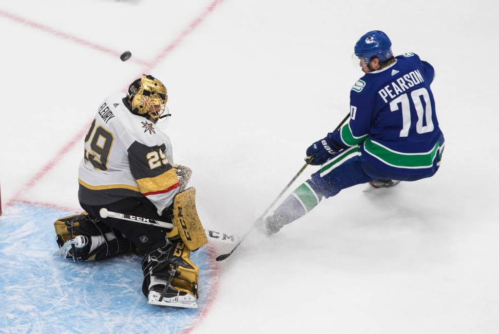 Vegas Golden Knights goalie Marc-Andre Fleury (29) makes a save on Vancouver Canucks' Tanner Pe ...