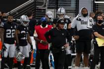 Las Vegas Raiders head coach Jon Gruden, center, reacts after Las Vegas Raiders quarterback Der ...