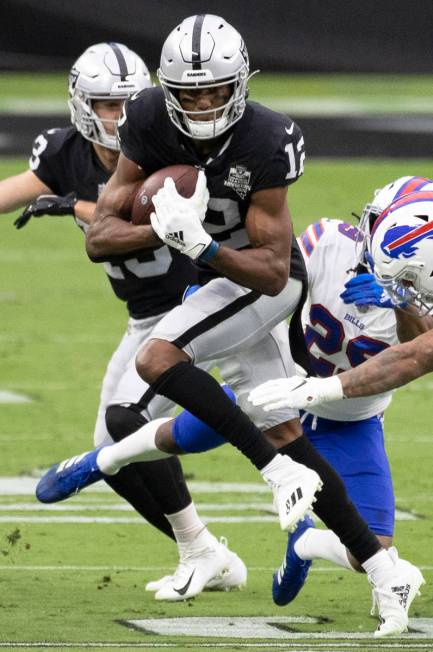 Las Vegas Raiders wide receiver Zay Jones (12) cuts up field past Buffalo Bills cornerback Josh ...