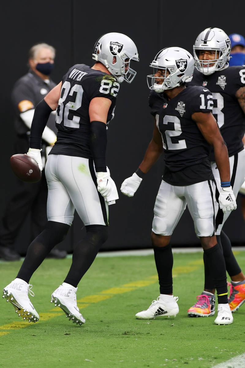 Las Vegas Raiders tight end Jason Witten (82) celebrates his touchdown with wide receiver Zay J ...