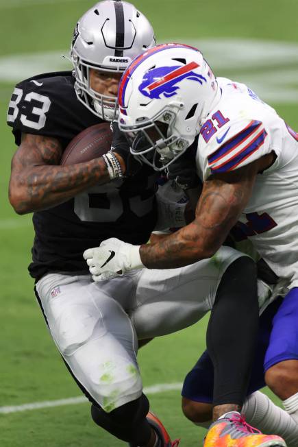 Las Vegas Raiders tight end Darren Waller (83) is tackled by Buffalo Bills free safety Jordan P ...