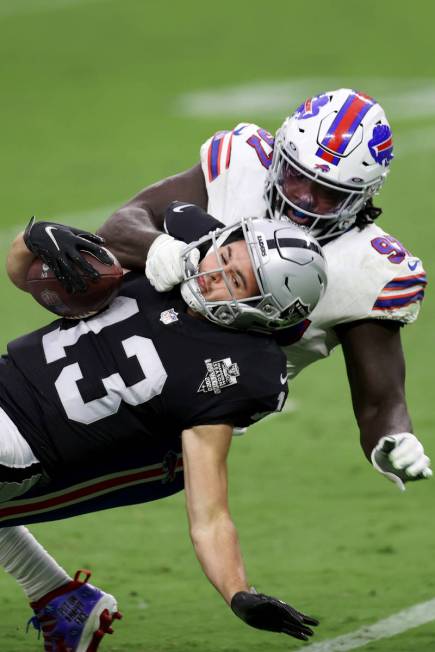 Buffalo Bills defensive end Mario Addison (97) tackles Las Vegas Raiders Las Vegas Raiders wide ...