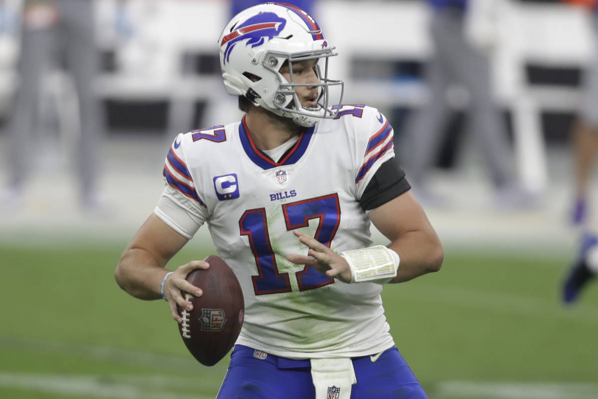 Buffalo Bills quarterback Josh Allen (17) looks to pass against the Las Vegas Raiders during th ...