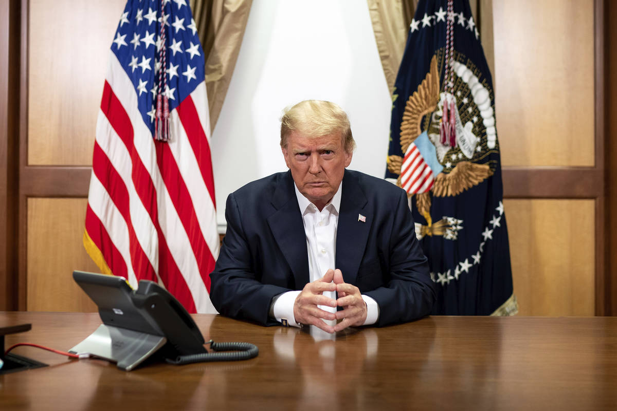 In this image provided by the White House, President Donald Trump listens during a phone call w ...