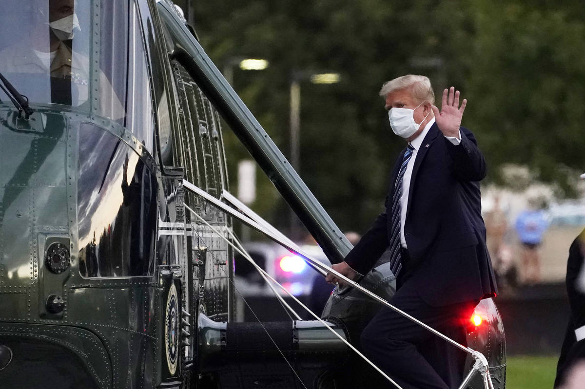 President Donald Trump boards Marine One to return to the White House after receiving treatment ...