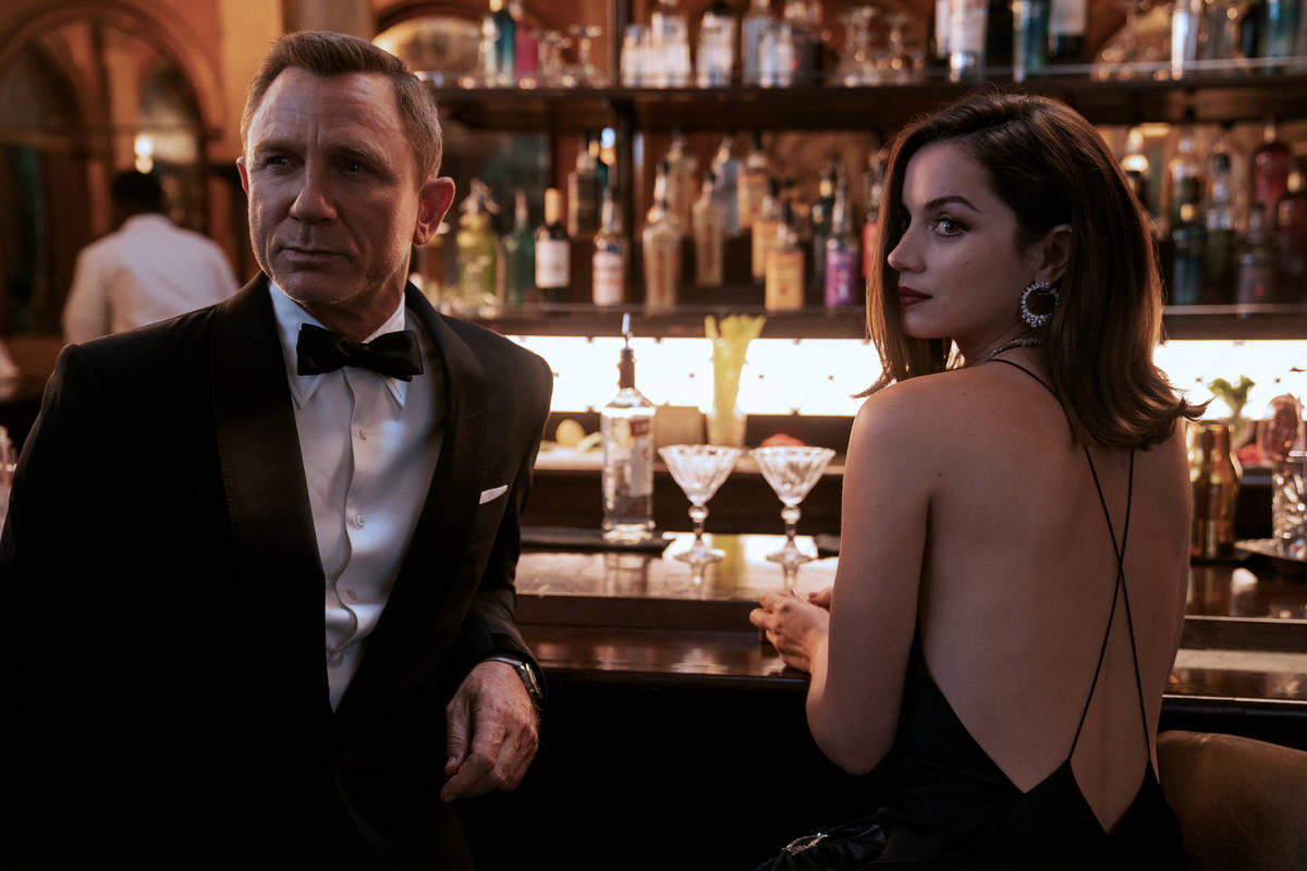 James Bond (Daniel Craig) and Paloma (Ana de Armas) star in "No Time to Die," whose opening dat ...