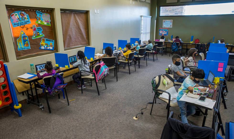 First and second graders work independently at their desks as they do classwork in the Vegas St ...