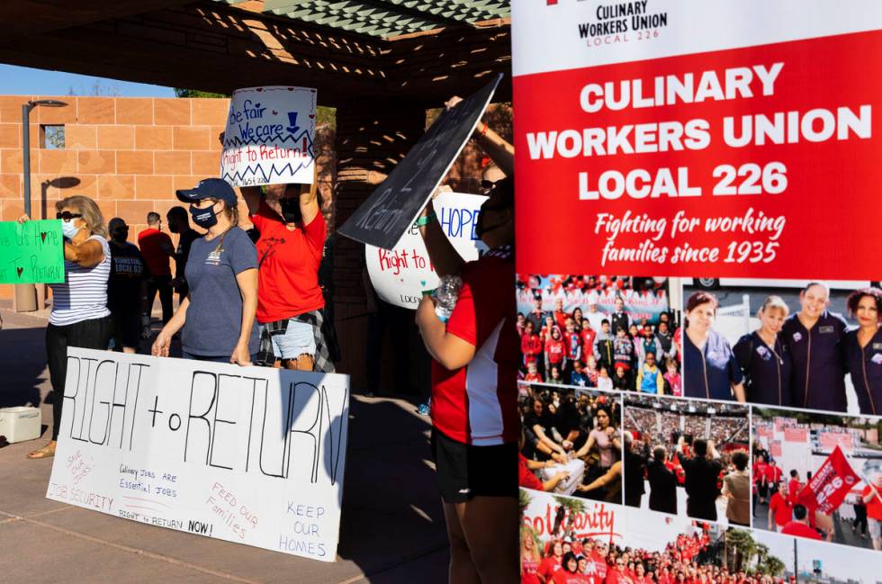 Workers rally outside of the Clark County Commission Building on Tuesday, Oct. 6, 2020, in Las ...