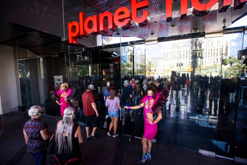 Guests head to the casino after the reopening of the Planet Hollywood Resort in Las Vegas on Th ...