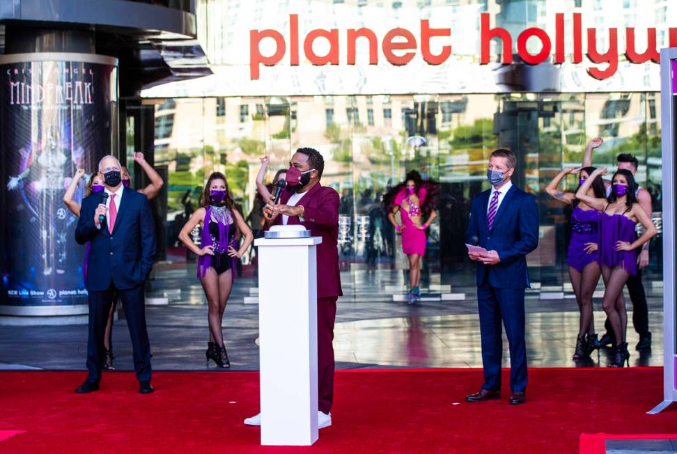 Actor Anthony Anderson gets ready to push a button to mark the reopening of the Planet Hollywoo ...