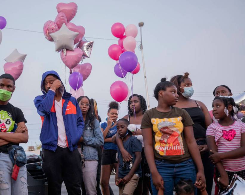 Family and friends mourn the death of 1-year, 9-month-old Sayah Deal, outside of 1719 H St. in ...