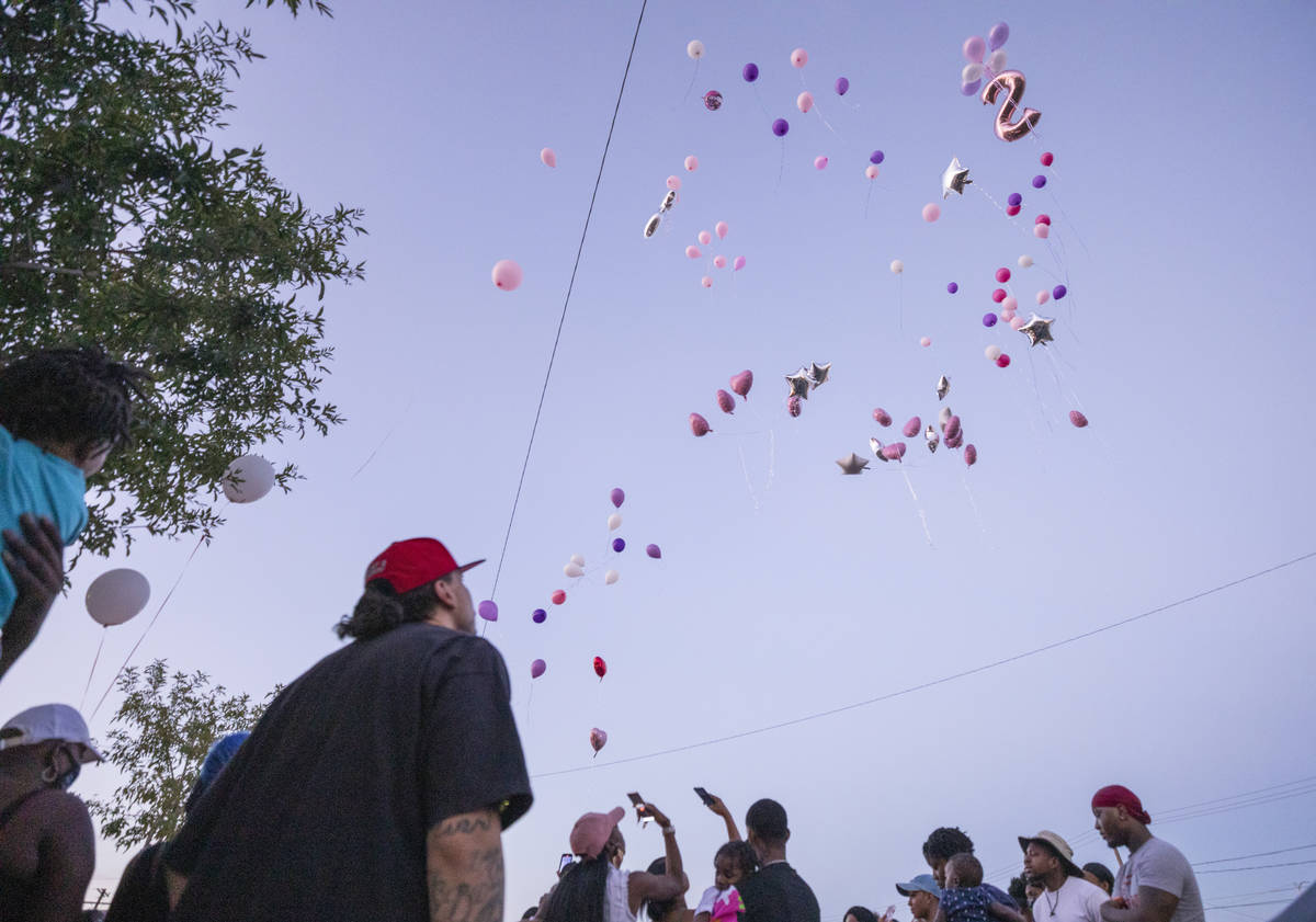 Family and friends let go of balloons during a memorial for the death of 1-year, 9-month-old Sa ...