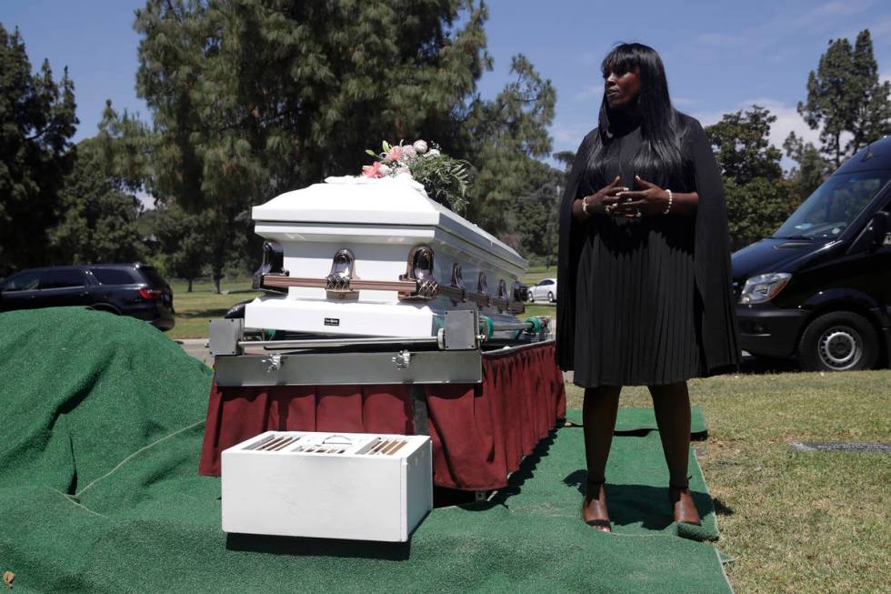 In this July 21, 2020, file photo, Candy Boyd, owner of Boyd Funeral Home, speaks to family mem ...