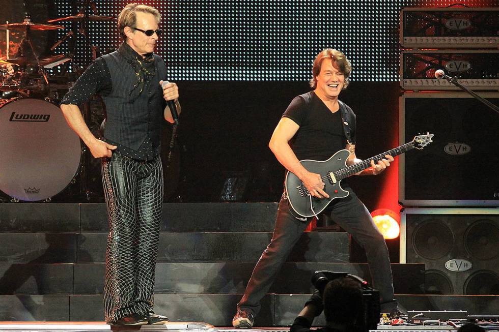 Eddie Van Halen, right, performs with lead singer David Lee Roth and the band Van Halen at the ...