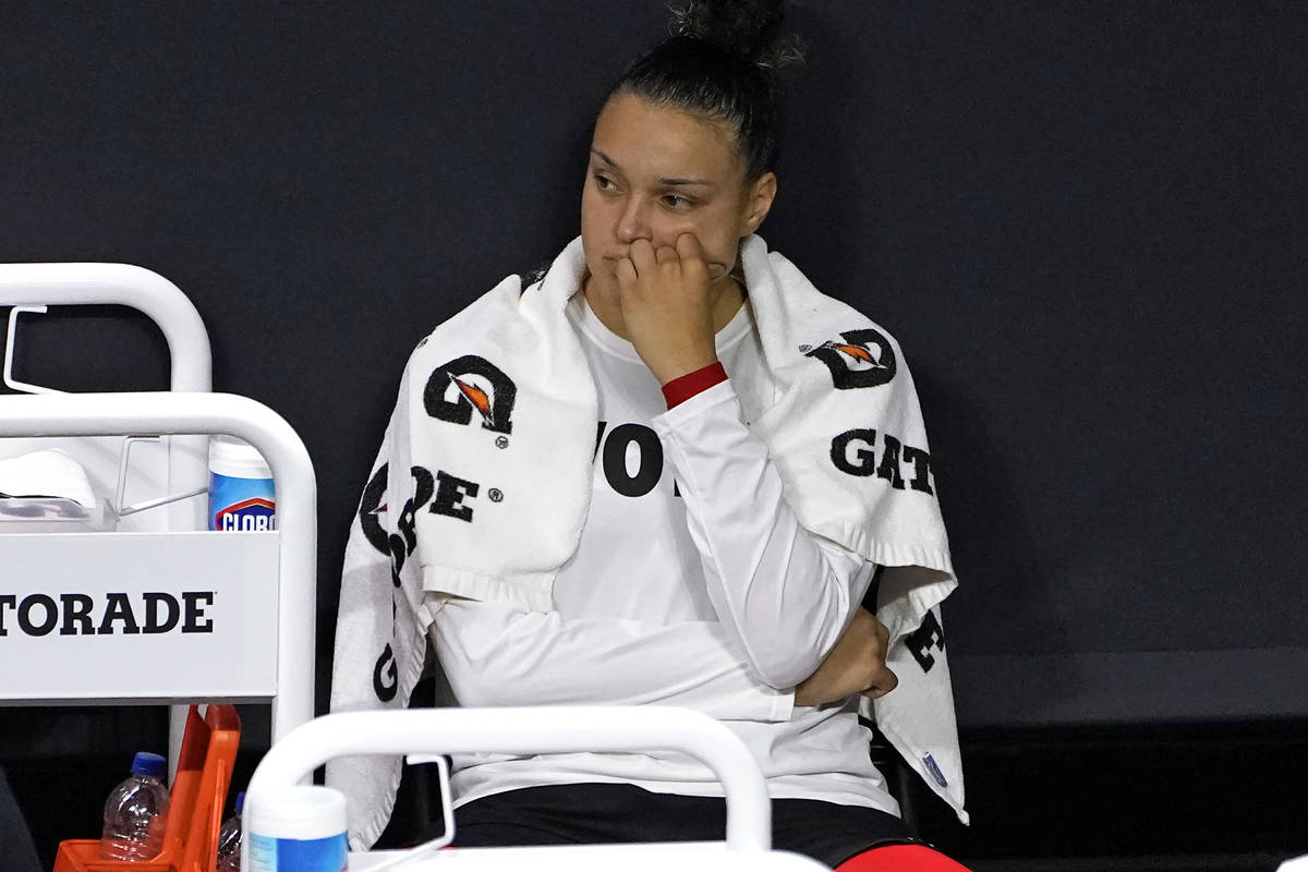 Las Vegas Aces guard Kayla McBride reacts on the bench after the team lost to the Seattle Storm ...