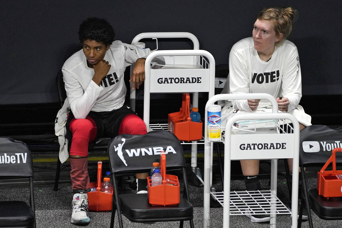 Las Vegas Aces forward Angel McCoughtry, left, and center Carolyn Swords react on the bench aft ...