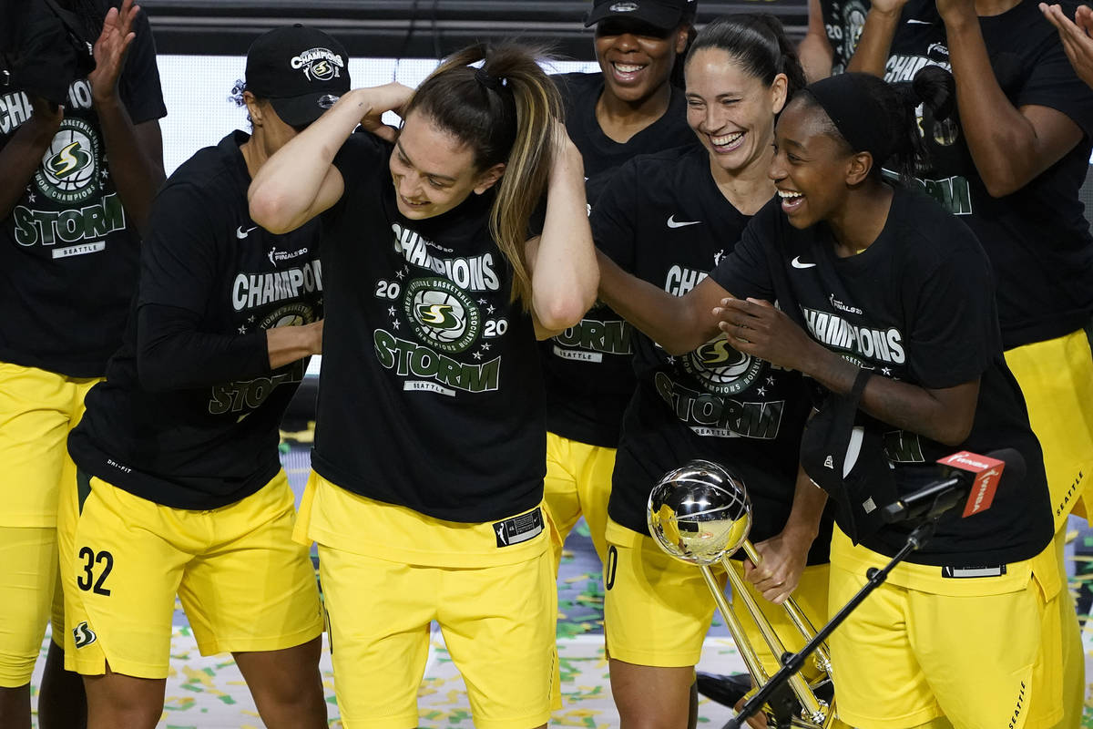 Seattle Storm forward Breanna Stewart, second from left, celebrates with teammates after being ...