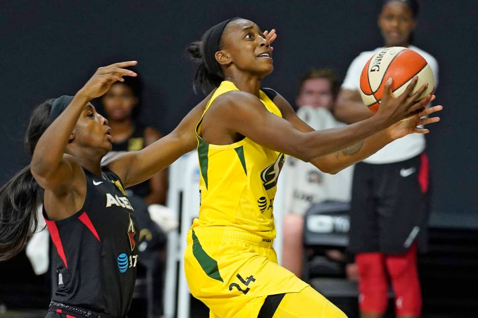 Seattle Storm guard Jewell Loyd (24) shoots after driving around Las Vegas Aces guard Jackie Yo ...