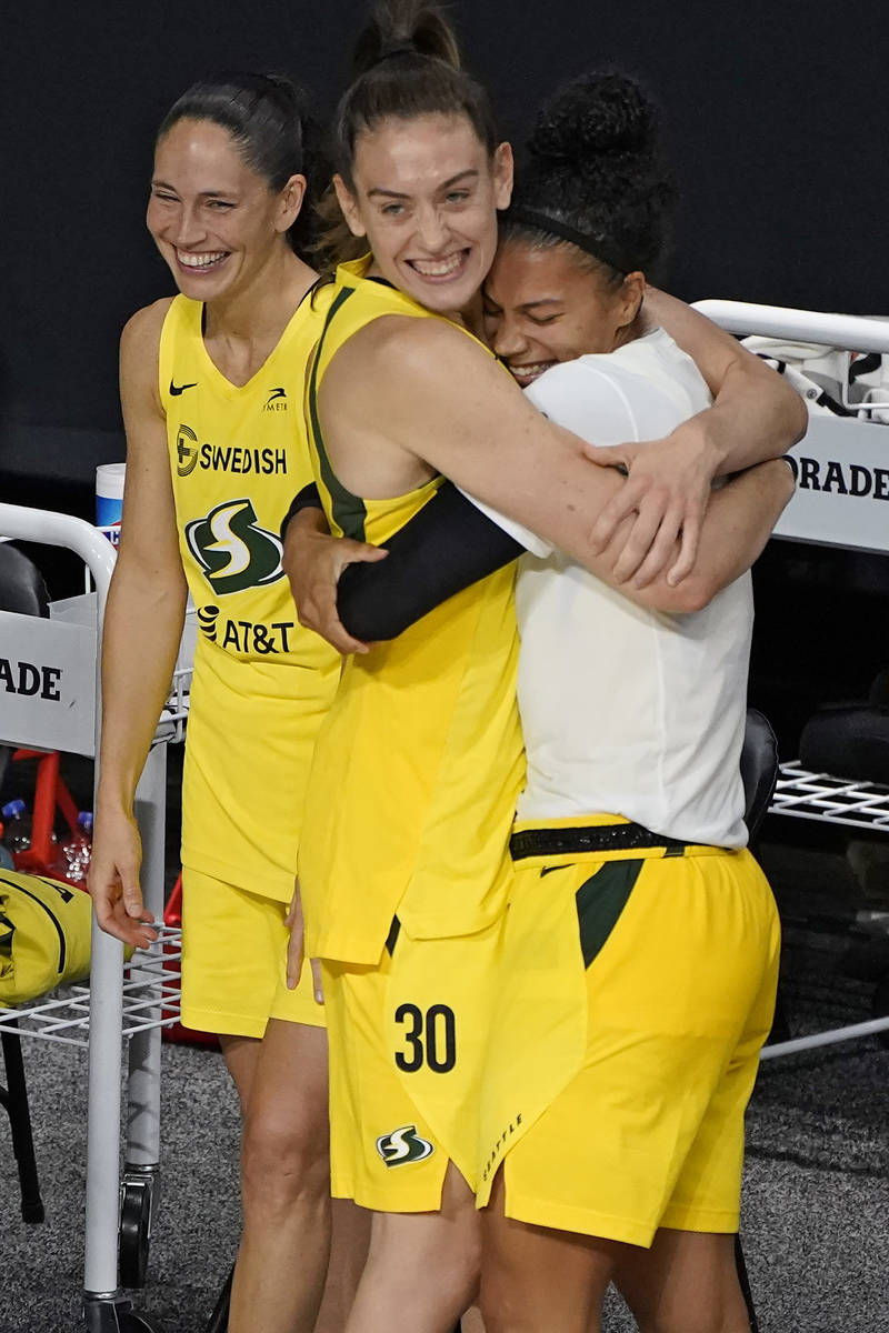 The Seattle Storm, from left, Sue Bird, Breanna Stewart, and Alysha Clark celebrate after the t ...