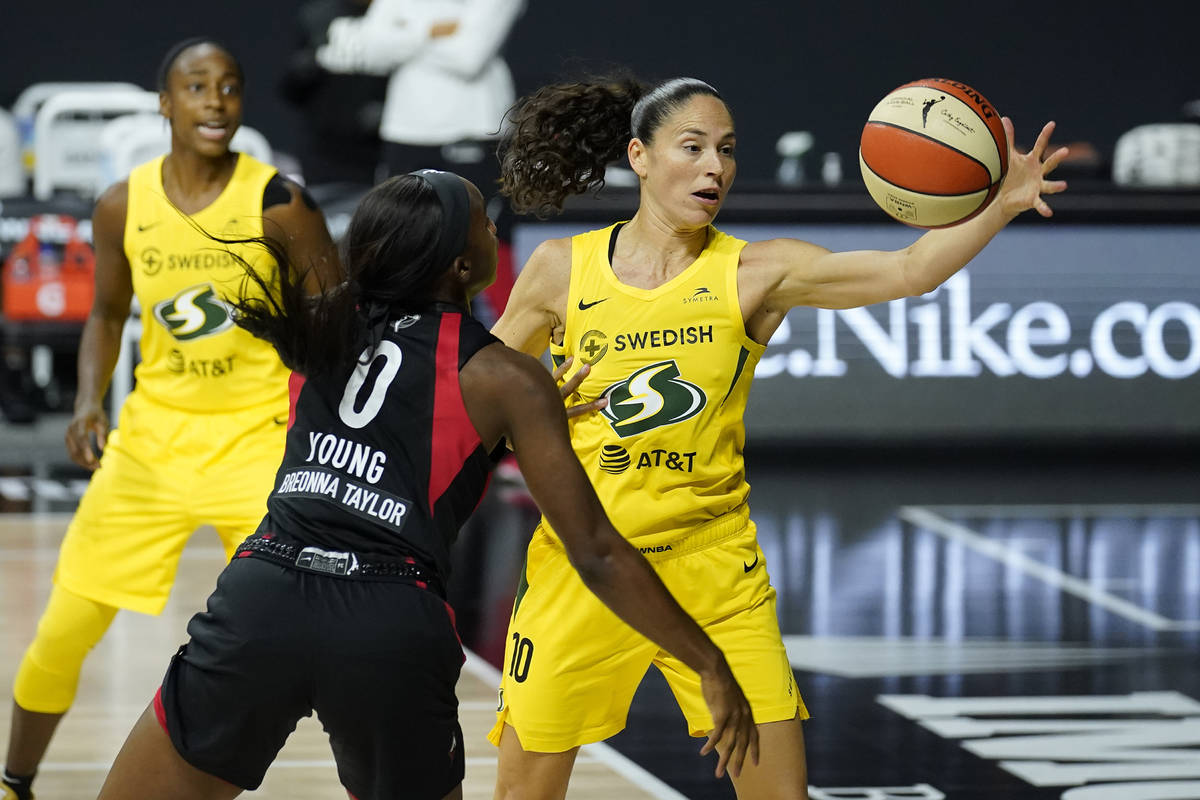 Seattle Storm guard Sue Bird (10) grabs the ball away from Las Vegas Aces guard Jackie Young (0 ...