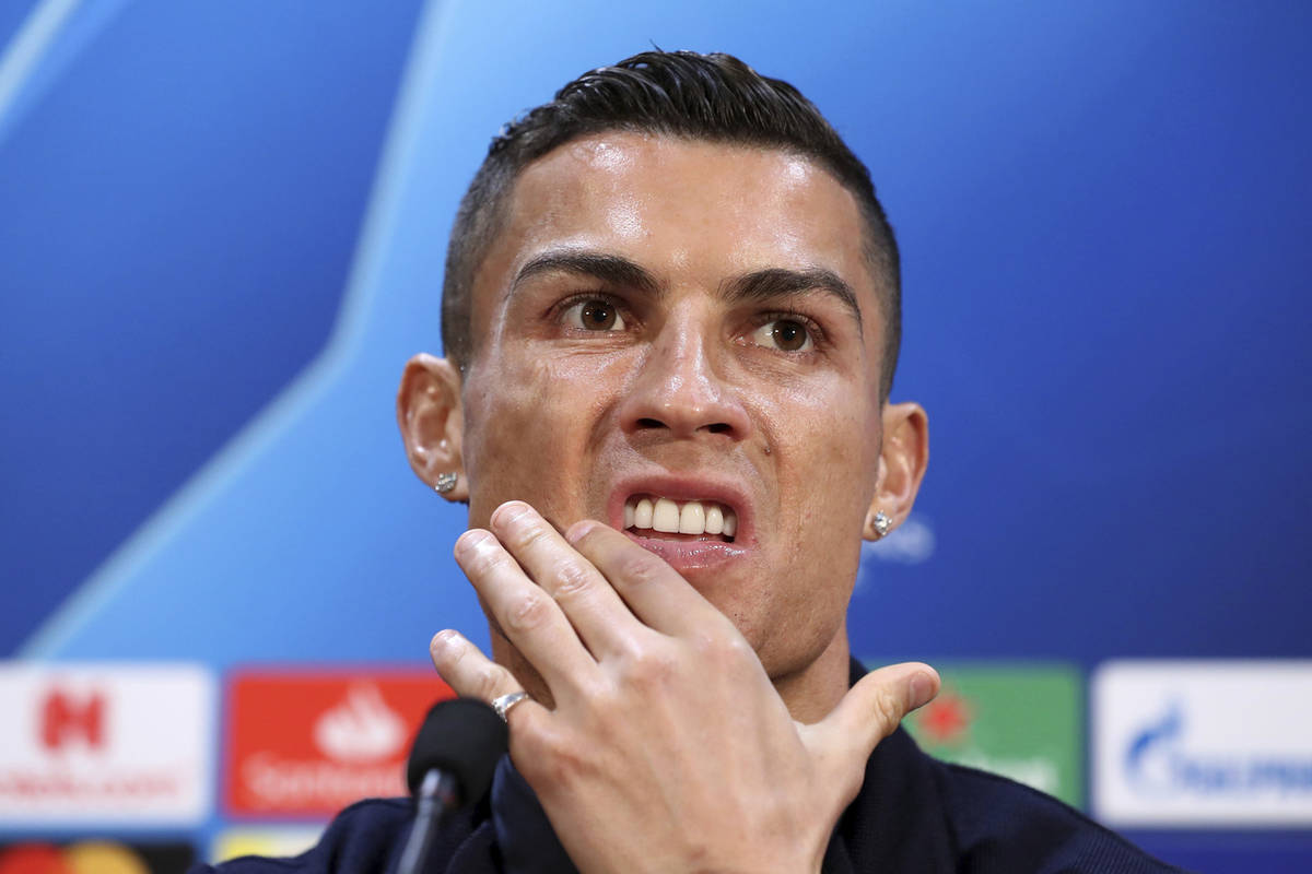 Juventus' Cristiano Ronaldo attends a press conference at Old Trafford, Manchester, Oct. 22, 20 ...