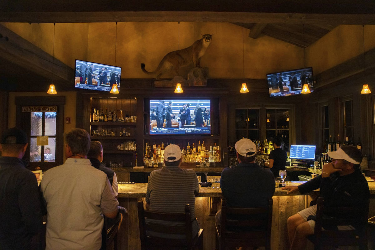 Members at Rock Creek Cattle Company watch live footage of Brendan Brisson celebrating with his ...