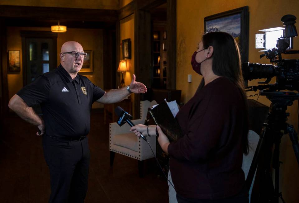 Golden Knights assistant director of player personnel Bob Lowes, left, discusses Vegas' second ...