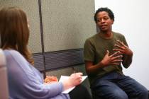 Jermaine Dillard Jr., right, is interviewed by Sitel Group coach Colleen Ewing during a job fai ...