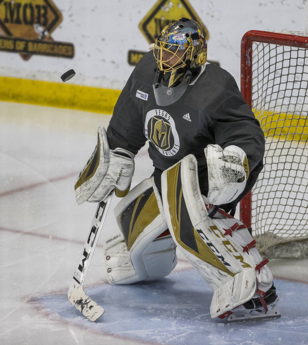 Vegas Golden Knights goaltender Marc-Andre Fleury (29) deflects a shot during practice at City ...