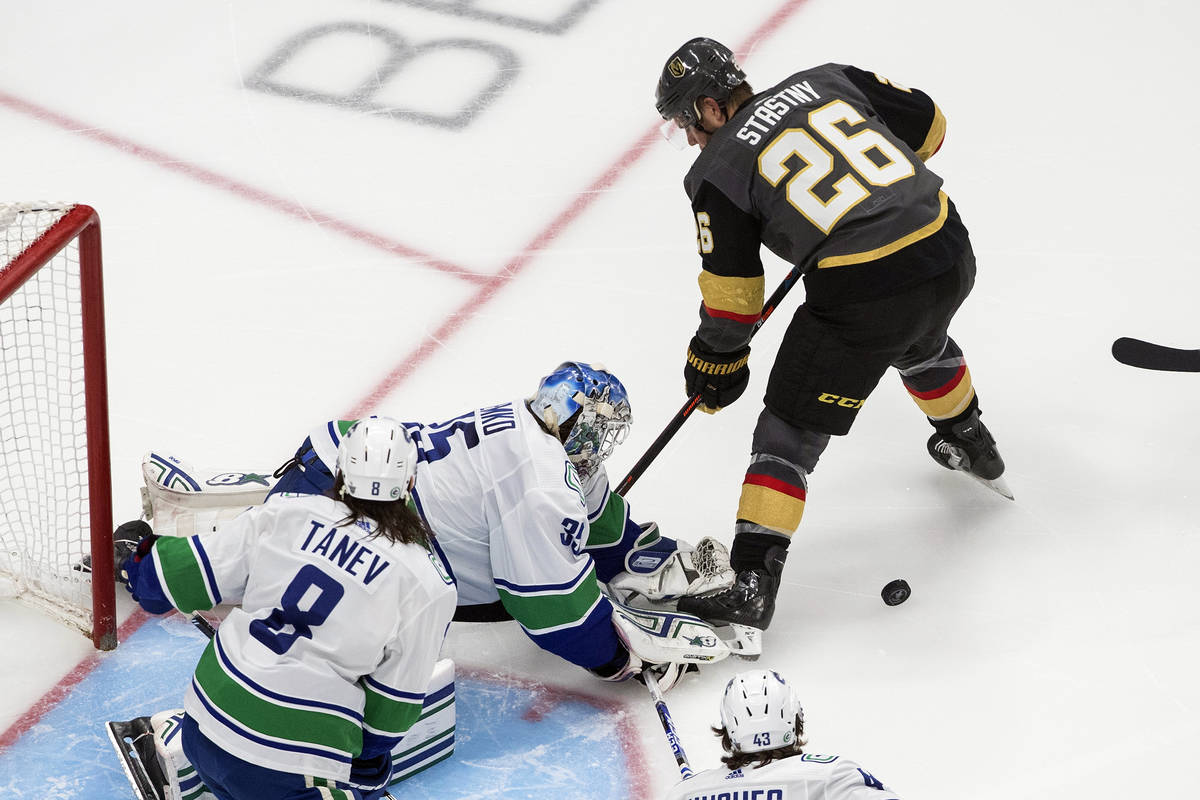 Vancouver Canucks goalie Thatcher Demko (35) makes a save against Vegas Golden Knights' Paul St ...