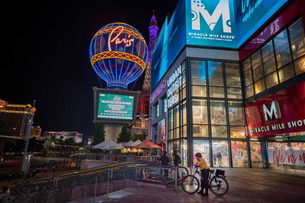 A security guard is seen outside of the Miracle Mile Shops entrance on the Las Vegas Strip, ear ...