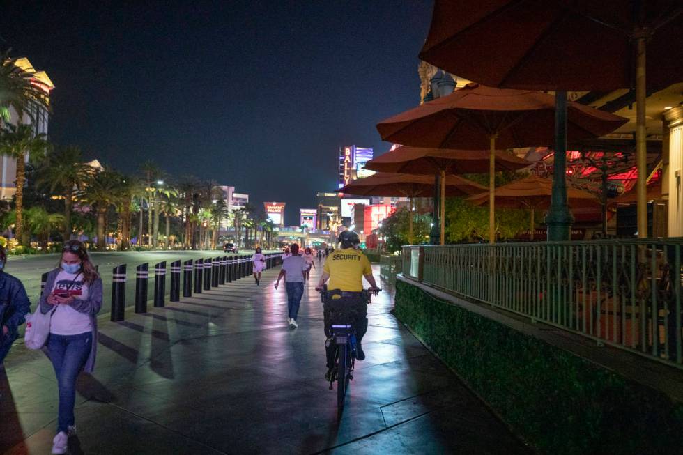 A security guard bikes near the Paris Hotel and Casino on the Las Vegas Strip, early Thursday, ...