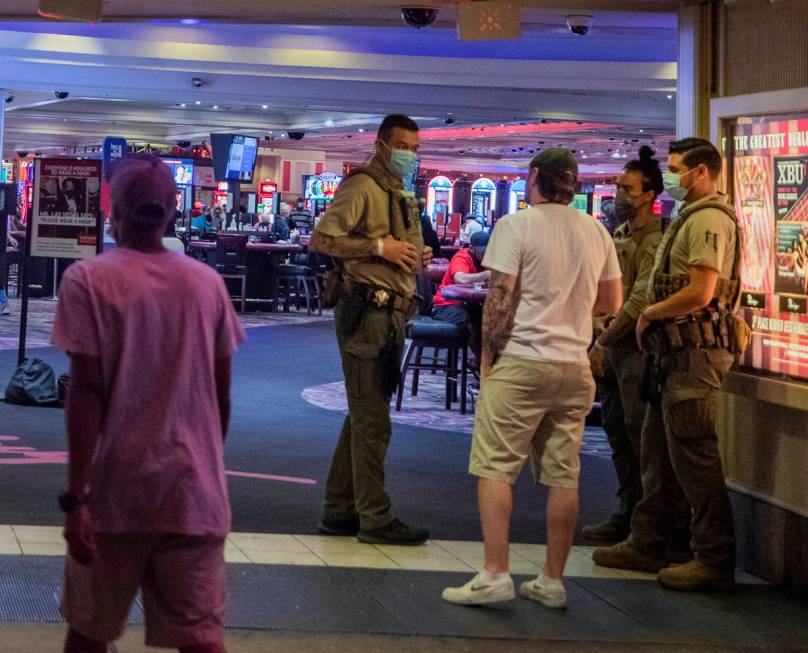 Security guards are seen at an entrance of the LINQ Hotel and Casino, on the Las Vegas Strip ea ...