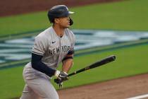 New York Yankees' Giancarlo Stanton watches his solo home run against the Tampa Bay Rays during ...