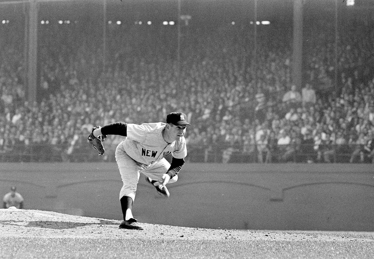 FILE - In this Oct. 12, 1960 file photo, New York Yankees pitcher Whitey Ford throws during the ...