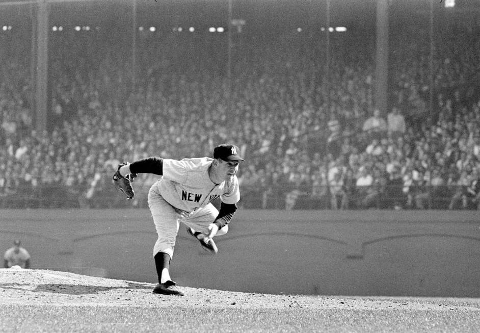 FILE - In this Oct. 12, 1960 file photo, New York Yankees pitcher Whitey Ford throws during the ...