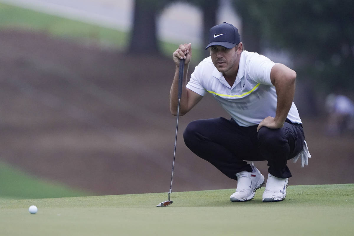 Brooks Koepka lines up a putt on the 11th hole during the first round of the Wyndham Championsh ...